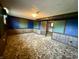 Spacious basement area with paneled walls, carpet flooring, and ample lighting at 801 Spring Valley Dr, Indianapolis, IN 46231