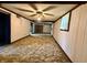 Large basement featuring a drop ceiling, carpet floors, and ample lighting at 801 Spring Valley Dr, Indianapolis, IN 46231