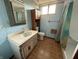 Bathroom features a vanity with storage, toilet, and shower with curtain at 801 Spring Valley Dr, Indianapolis, IN 46231