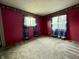 Bedroom featuring red walls and carpet at 801 Spring Valley Dr, Indianapolis, IN 46231