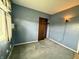 Bedroom featuring light blue walls and carpet at 801 Spring Valley Dr, Indianapolis, IN 46231