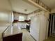 Galley kitchen with white cabinets at 801 Spring Valley Dr, Indianapolis, IN 46231