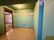 A room with laminate flooring and painted green walls at 801 Spring Valley Dr, Indianapolis, IN 46231