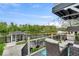 Outdoor deck with seating area offers a relaxing view of the water at 2222 E 75Th St, Indianapolis, IN 46240