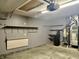 Garage interior with overhead storage and utility area at 7254 Broyles Ln, Indianapolis, IN 46217