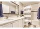 Bright bathroom showcases a double sink vanity with white cabinets and modern fixtures and tiled shower at 10866 Flower Mound Pl, Fishers, IN 46037
