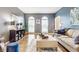 Spacious living room with hardwood floors, decorative accents, and comfortable seating, creating a cozy atmosphere at 10866 Flower Mound Pl, Fishers, IN 46037