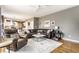 Inviting living room connects to the kitchen, features comfortable seating, and neutral decor for relaxation at 10866 Flower Mound Pl, Fishers, IN 46037