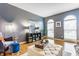 Inviting living room filled with natural light from arched windows and hardwood flooring at 10866 Flower Mound Pl, Fishers, IN 46037