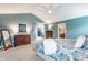 Large main bedroom with dressers, a walk-in closet, and a vaulted ceiling with a ceiling fan at 10866 Flower Mound Pl, Fishers, IN 46037