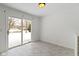 Dining area with sliding glass doors to the backyard and stylish tile flooring at 11962 Trolley Rd, Indianapolis, IN 46236