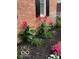 Brick wall with canna lilies and other colorful flowers at 12540 Sandstone Run, Carmel, IN 46033