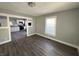 Living room with hardwood floors and view of kitchen at 1719 Nelson Ave, Indianapolis, IN 46203