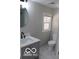 Clean bathroom with gray walls and a white vanity at 231 S Routiers Ave, Indianapolis, IN 46219