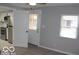 Bedroom with gray walls, new flooring and access to kitchen at 231 S Routiers Ave, Indianapolis, IN 46219