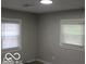 Gray bedroom with two windows and new flooring at 231 S Routiers Ave, Indianapolis, IN 46219