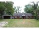 Brick ranch home with attached garage and spacious yard at 231 S Routiers Ave, Indianapolis, IN 46219