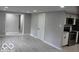 Modern kitchen with white cabinets, stainless steel appliances and gray walls at 231 S Routiers Ave, Indianapolis, IN 46219