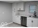 Modern white kitchen with stainless steel appliances at 231 S Routiers Ave, Indianapolis, IN 46219