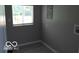 Small laundry room with gray walls and vinyl flooring at 231 S Routiers Ave, Indianapolis, IN 46219