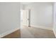 Small bedroom featuring wall-to-wall carpeting, white walls, and closet at 2521 Prospect St, Indianapolis, IN 46203