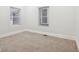 Bedroom featuring wall-to-wall carpeting, white walls, and windows with coverings at 2521 Prospect St, Indianapolis, IN 46203