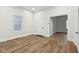 Bright room with light wood floors, white trim, and two doorways at 2521 Prospect St, Indianapolis, IN 46203
