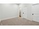 Bedroom featuring wall-to-wall carpeting, white walls, and white doors at 2521 Prospect St, Indianapolis, IN 46203