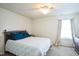 Bright bedroom with a double bed and large window at 3035 Arrowroot Ln, Indianapolis, IN 46239