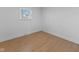 Bright bedroom with light wood floors and a window at 454 Tulip Dr, Mooresville, IN 46158