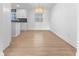 Modern dining room with hardwood floors and new light fixture at 454 Tulip Dr, Mooresville, IN 46158