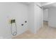 Basement laundry room with tile floors and hookups for washer and dryer at 454 Tulip Dr, Mooresville, IN 46158