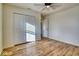 Bedroom with double door closet and wood-look floors at 5701 Brookstone Dr, Indianapolis, IN 46234