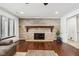 Stone fireplace in living room with hardwood floors at 5904 Allisonville Rd, Indianapolis, IN 46220