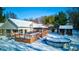 Aerial view showcasing home, deck, gazebo and pool in winter wonderland at 6361 Crystal Springs Dr, Avon, IN 46123
