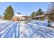 Snowy backyard with a pool, deck, pergola, and small cabin at 6361 Crystal Springs Dr, Avon, IN 46123