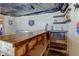 Finished basement with a rustic bar, dartboard, and seating at 6361 Crystal Springs Dr, Avon, IN 46123