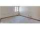 Empty bedroom with carpeted floor, window, and wood trim at 6361 Crystal Springs Dr, Avon, IN 46123