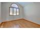 Bright bedroom with hardwood floors and arched window at 6361 Crystal Springs Dr, Avon, IN 46123