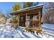 Small wooden cabin in snowy backyard, features front porch at 6361 Crystal Springs Dr, Avon, IN 46123