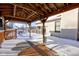 View from under a deck pergola, showing a snow-covered deck and house at 6361 Crystal Springs Dr, Avon, IN 46123
