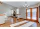 Bright dining room with hardwood floors, fireplace, and access to deck at 6361 Crystal Springs Dr, Avon, IN 46123