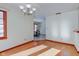 Dining area with hardwood floors and chandelier, view of kitchen at 6361 Crystal Springs Dr, Avon, IN 46123