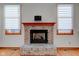 Brick fireplace with wood mantel in living room at 6361 Crystal Springs Dr, Avon, IN 46123