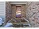 Home's entrance with a burgundy door and brick facade at 6361 Crystal Springs Dr, Avon, IN 46123