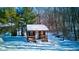Charming guest house nestled in a snowy landscape, ideal for added privacy at 6361 Crystal Springs Dr, Avon, IN 46123