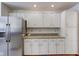 White kitchen cabinets and granite countertops at 6361 Crystal Springs Dr, Avon, IN 46123