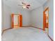 Large main bedroom with double doors to hallway, carpet, and access to bathroom at 6361 Crystal Springs Dr, Avon, IN 46123