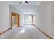 Spacious main bedroom with carpeted floor, en-suite bathroom access, and window at 6361 Crystal Springs Dr, Avon, IN 46123