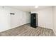 Large kitchen featuring vinyl flooring, a refrigerator, and ample space at 715 N Warman Ave, Indianapolis, IN 46222